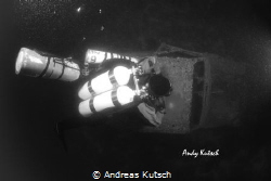 Diver along the R4 Wreck by Andreas Kutsch 